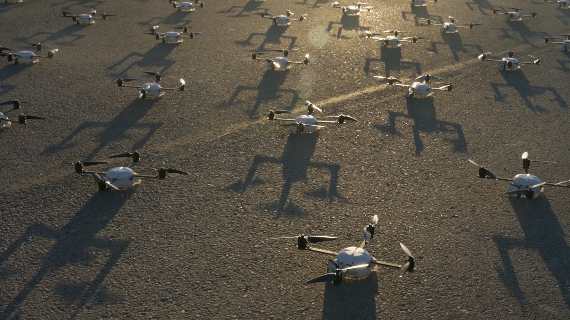 Drone fleet on the ground at golden hour