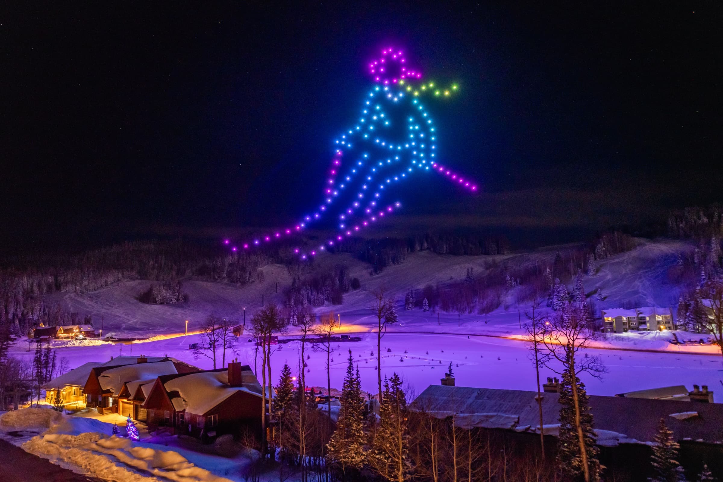 A skier drawn in drones above a winter lodge