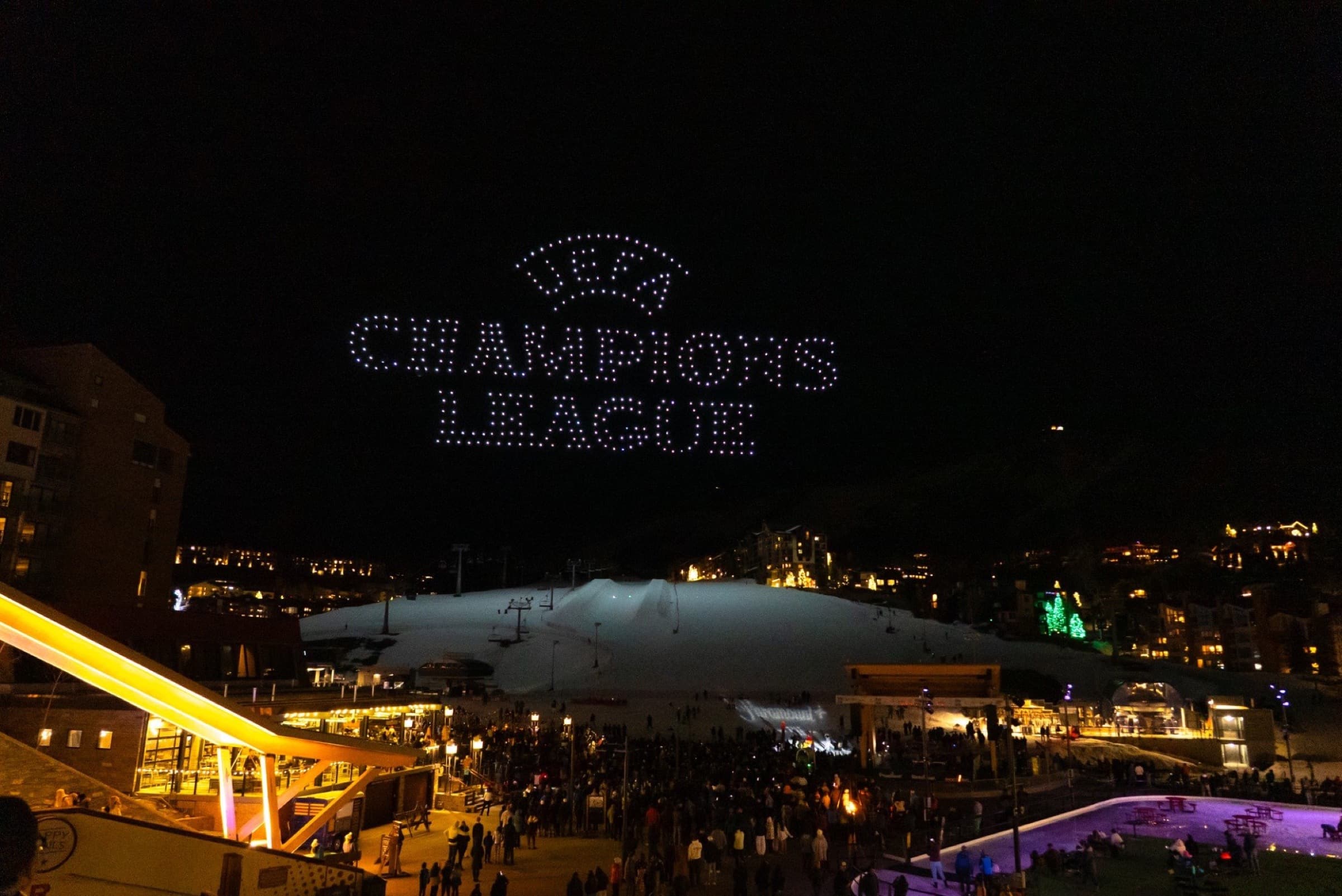 UEFA Champions League spelled in drones above a mountain resort crowd